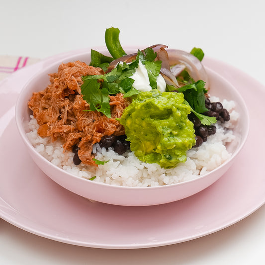 Chicken Tinga Burrito Bowl with tender chicken, succulent black beans, buttery rice, and fresh fajita veggies from Kitchenette, a Santa Barbara based family meal delivery service.